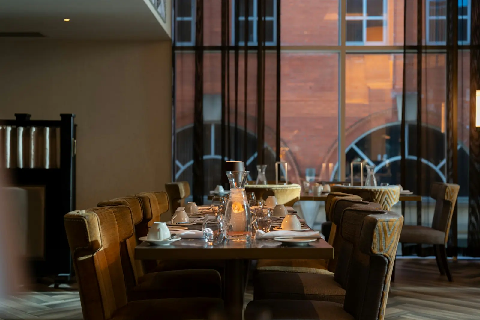 Candlelit table setting for fine dining at FLO Lagos